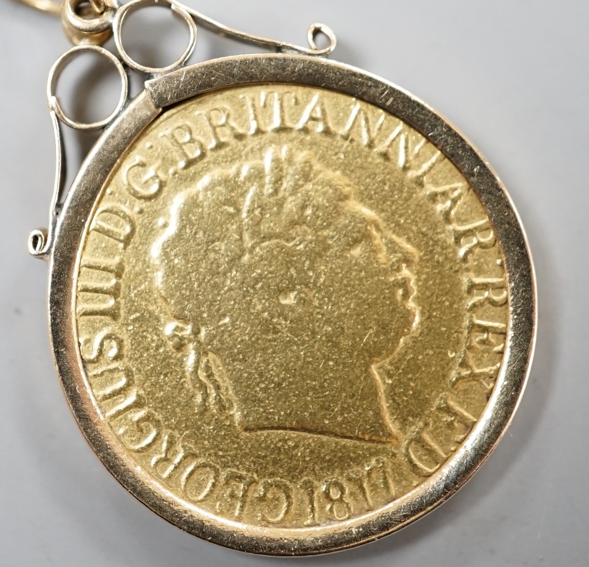 A George III 1817 gold sovereign, in later 9ct gold pendant mount, gross 9.1 grams.